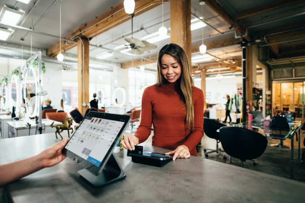 Woman Paying at Retail Store